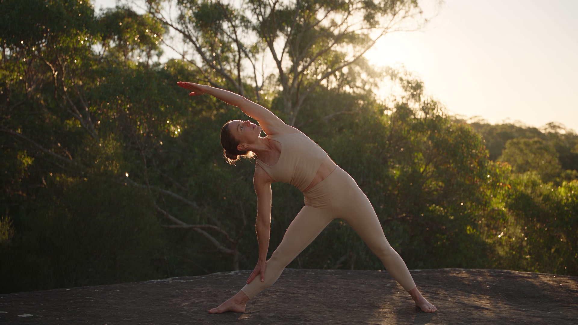 A quiet moment of yoga outdoors in warm morning light